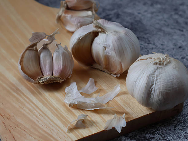 istock Fresh bulb and garlic cloves on grey background 2243226681