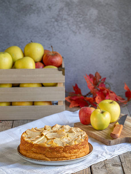 istock Homemade apple cake with fresh apples and wooden box on rustic table 2243228198