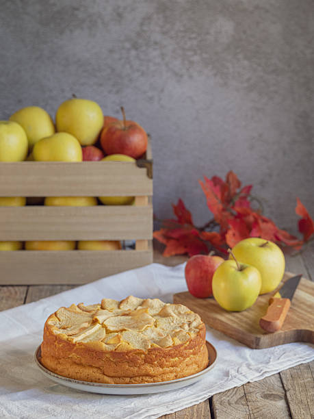 istock Homemade apple cake with fresh apples and wooden box on rustic table 2243228201