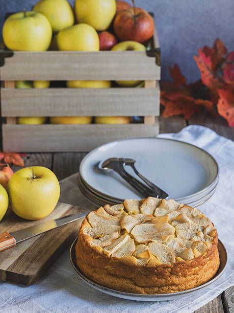 istock Homemade apple cake with fresh apples and wooden box on rustic table 2243228290