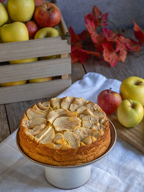 istock Homemade apple cake with fresh apples and wooden box on rustic table 2243228310