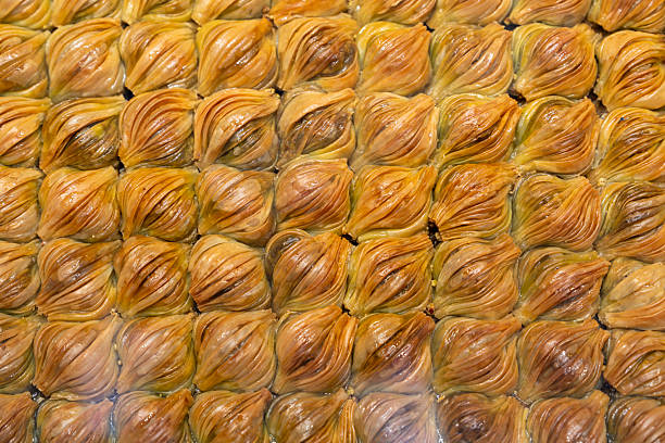 Overhead view of assorted baklava pieces — traditional Turkish dessert made with nuts and syrup.