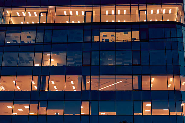 istock Modern corporate office building facade at night 2243237046