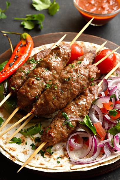 istock Grilled lula kebab with fresh vegetables on flat bread 2243240738