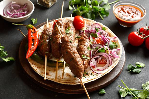 istock Grilled lula kebab with fresh vegetables on flat bread 2243240743