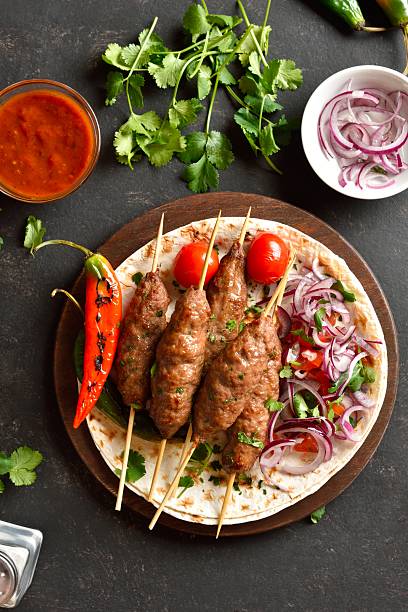 istock Grilled lula kebab with fresh vegetables on flat bread 2243240762