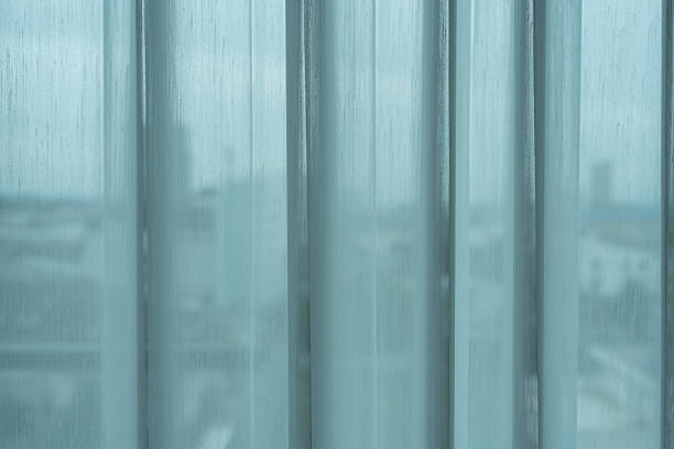istock Sheer curtains cascade gracefully across a window. 2243241838