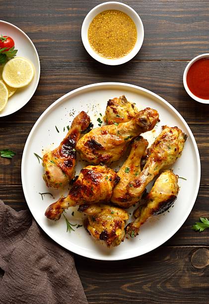 istock Barbecue roasted chicken drumsticks served with sauce 2243243178