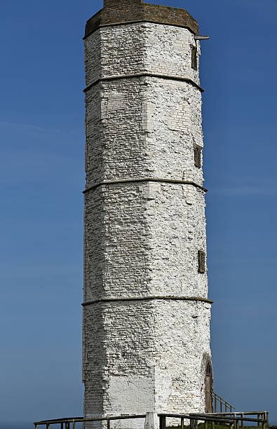 Danish island Helnaes with typical lighthouse seen from drone point of view.