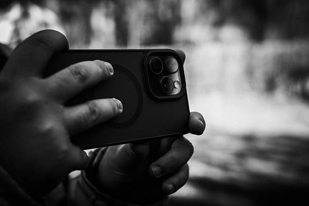 photographer taking a photo close up with a phone