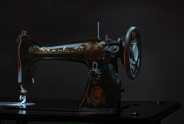 istock A vintage sewing machine with gold and black embroidery 2243246082