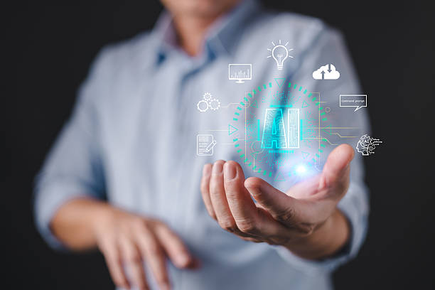 istock A person presents a glowing holographic interface featuring the letters AI surrounded by icons representing innovation, data, cloud, command, and technology, artificial intelligence concepts. 2243246355