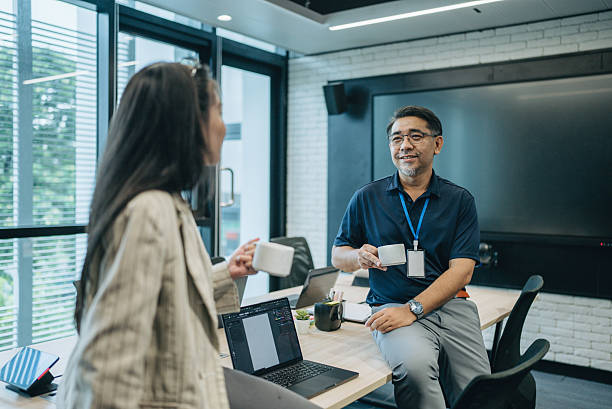 istock Business Professionals Engage in Office Meeting 2243253923