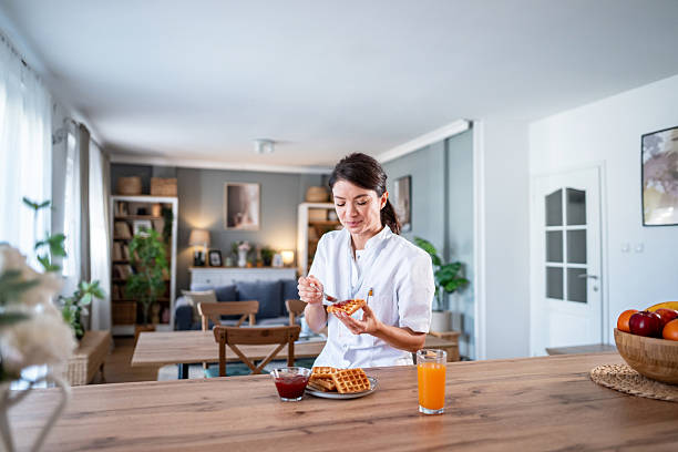 istock Healthcare worker eating breakfast at home before shift 2243256257