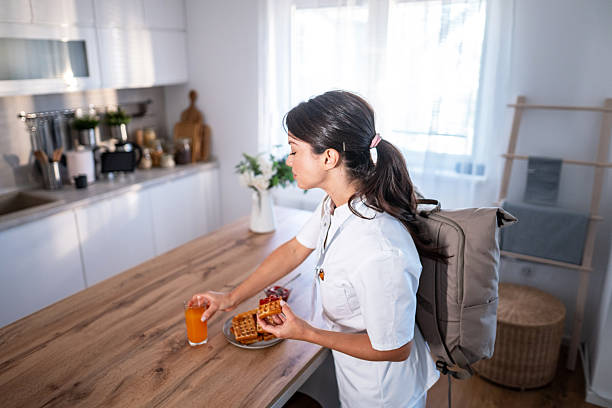 istock Healthcare worker eating quick breakfast before morning shift 2243256431