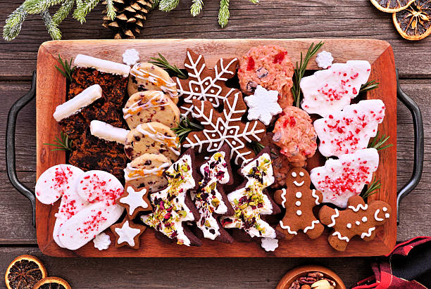 istock Christmas dessert tray. Above view table scene on a dark wood background. 2243256542