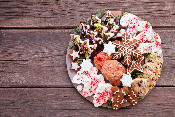 istock Christmas cookie platter. Overhead view on a dark wood background. 2243257090