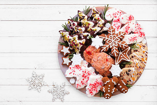 Christmas cookie platter. Above view on a white wood background.