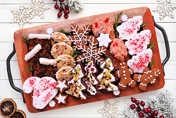 istock Christmas dessert tray. Overhead view table scene on a white wood background. 2243257374
