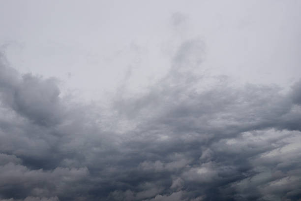 istock Dark storm clouds gathering in the sky, ominous and heavy atmosphere before a downpour 2243260218