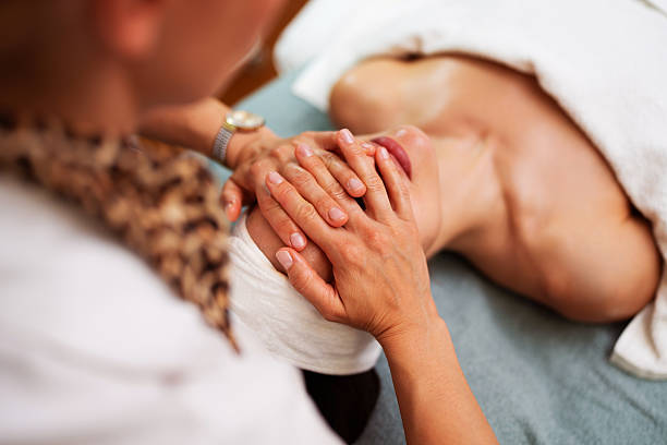 istock Beautician giving relaxing face massage to client 2243265166