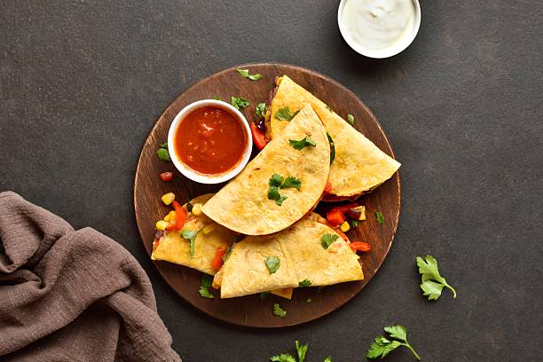 istock Delicious quesadilla with fresh vegetables served with sauce 2243269664