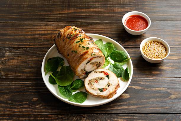 istock Roasted pork roll stuffed with mushroooms, onion, red bell pepper, spinach 2243271698