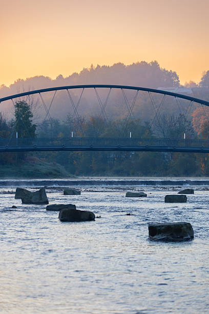 istock Golden Hour over an Arched Bridge and Autumn River 2243273394