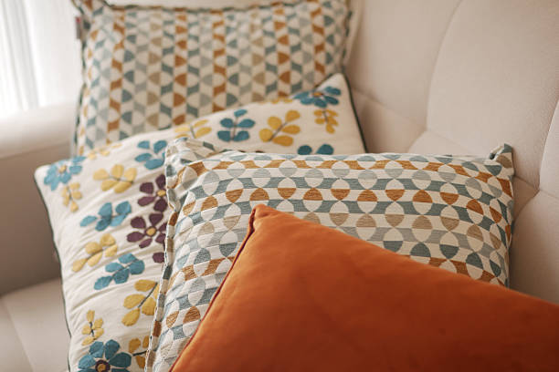 istock Decorative pillows arranged on a cozy couch in living room 2243279846
