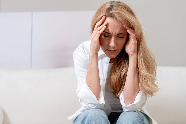 istock Mature woman experiences migraine while feeling overwhelmed and fatigued 2243279885