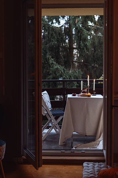 istock Cozy autumn evening on a balcony with candlelight and serene views 2243281535