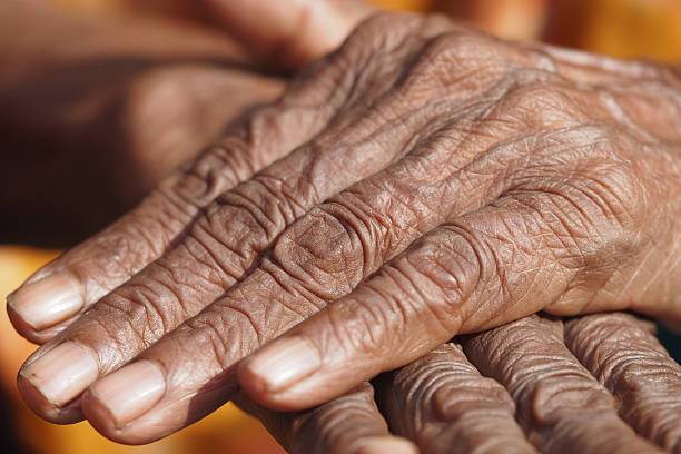 istock Wrinkled hands show time's passage 2243284251