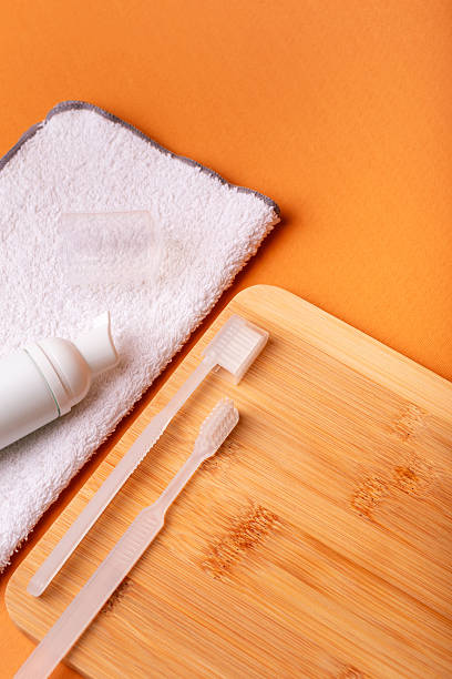 istock White toothbrushes, toothpaste and face towel. Morning routine and health care. 2243284334