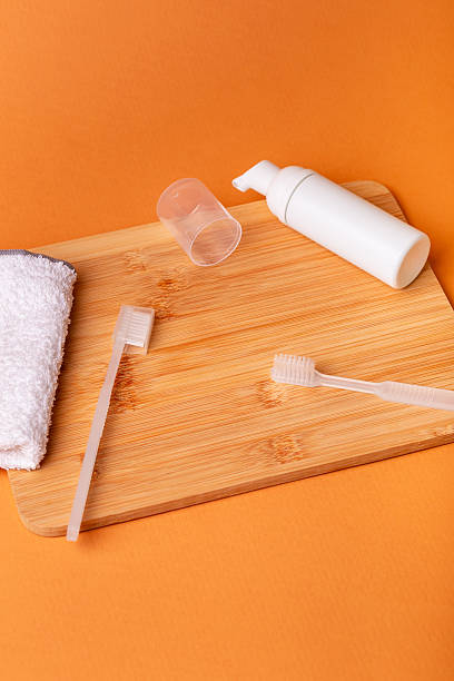 istock White toothbrushes, toothpaste and face towel. Morning routine and health care. 2243284475
