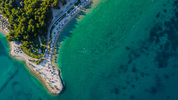 istock Top view of small beach and transparent turquoise water 2243287777