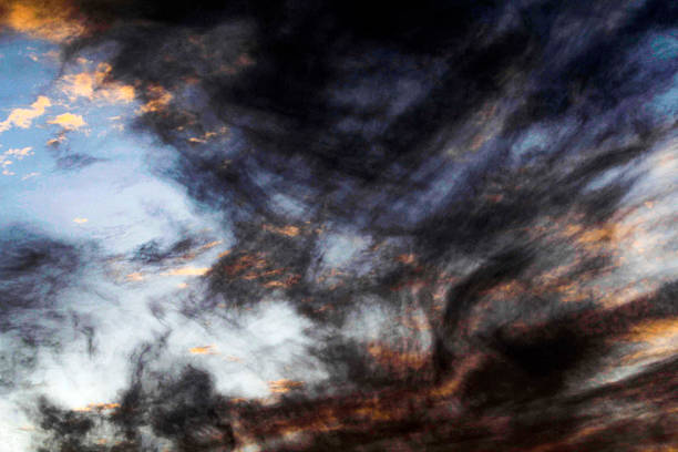A captivating display of turbulent clouds, swirling with dark hues and illuminated by hints of golden light in Sydney, NSW, Australia. (Photo by Tara Chand Malhotra)