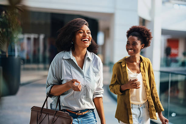 istock Friends Laughing While Shopping in the Mall, Casual Day Out Between Women 2243296830