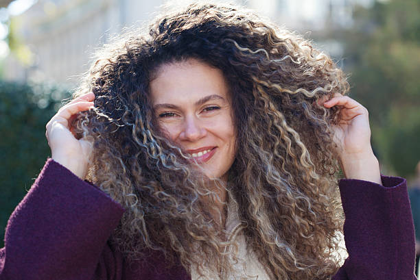 Young woman tossing hair