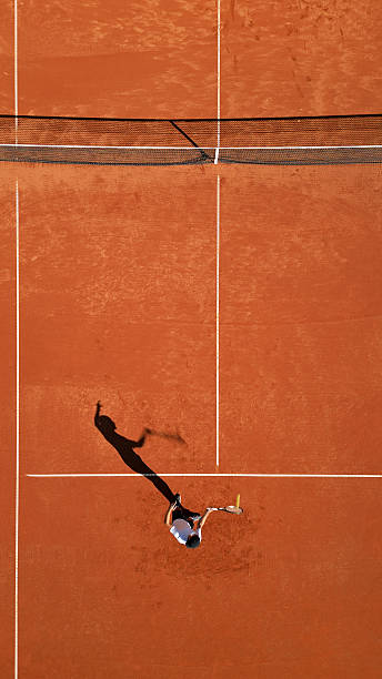 istock Tennis Player Serving on Clay Court 2243310860