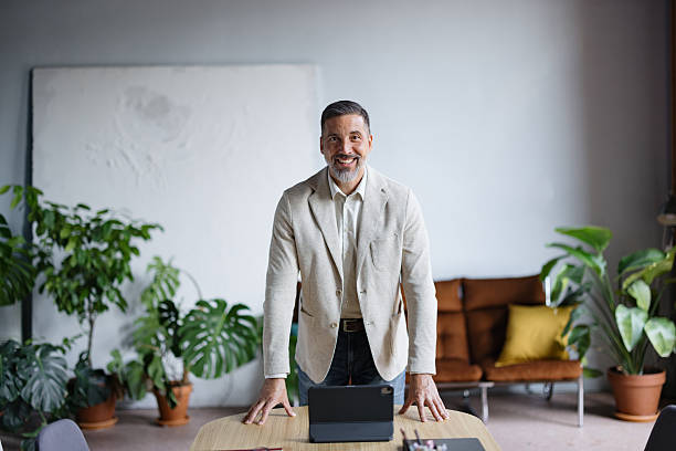 istock Mature businessman standing confidently in modern office 2243311074