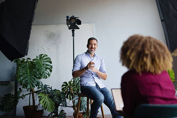 istock Man giving presentation during business interview in studio 2243311179