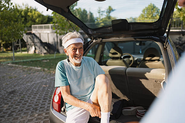 istock Senior man smiling, preparing for outdoor exercise 2243311220