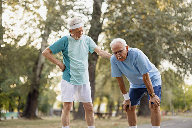istock Senior man supporting friend after exercising in park 2243311289
