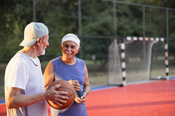 istock Senior men friends talking after playing basketball 2243311447