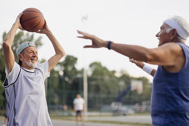 istock Senior friends playing basketball, enjoying active lifestyle 2243311523