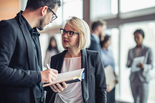 istock Caucasian Business Executives Engaging in Conversation at Corporate Event 2243312617