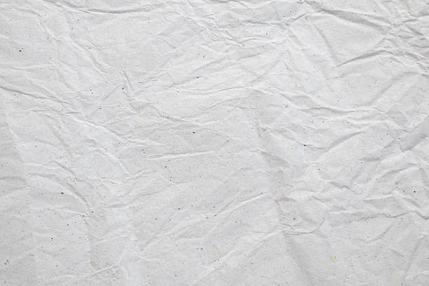 istock Abstract white crumpled and creased recycle paper texture background 2243315779
