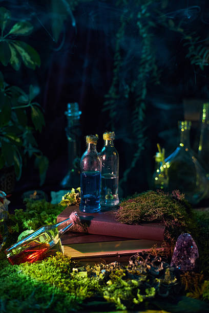 istock In a serene forest setting at dusk, vibrant potions fill glass bottles resting on a moss-covered surface. scene combines elements of nature and a sense of magic, inviting imagination 2243317634