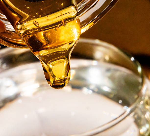 istock honey pouring, color 2243318303