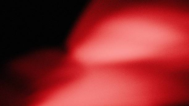 istock an image poster design of a noise effect light wave of light red on a dark background 2243320813